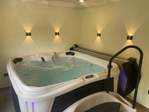 a jacuzzi tub in a room with lights at Hotel Ryo 74b Piso 7 Vip in Medellín +61 photos