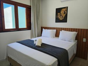 Postel nebo postele na pokoji v ubytování Aptos em cond. c/ Piscina e Churrasqueira, Imbassaí - FOSs + 60 fotografií