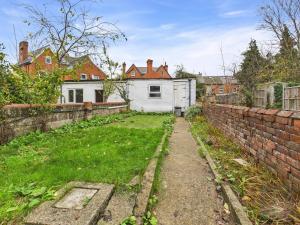 an empty yard in front of a brick wall at 3 Bed House in Reading Area in Reading
