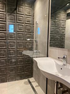 a bathroom with a sink and a glass shower at eliamaria domus artificis in Lefkada Town +26 photos