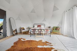 a bedroom with a bed and a white ceiling at Winter Nights in a Secluded Canyon Dome in Valle +17 photos