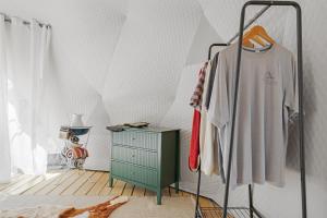 a room with a clothes rack and a dresser at Winter Nights in a Secluded Canyon Dome in Valle