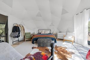 a bedroom with a bed in a tent at Winter Serenity in a Luxury Glamping Dome in Valle