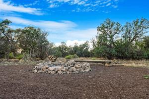 a pile of rocks sitting on top of a dirt field at Unplug & Recharge Cozy Off-Grid Glamping in Valle