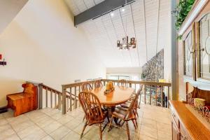 a dining room with a wooden table and chairs at Eagle's Nest in Big Creek