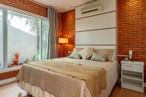 Una cama o camas en una habitación de BANGALÔ NATUREZA