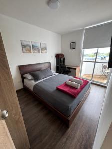 En eller flere senge i et værelse på Apartamento en Armenia, Conjunto residencial Ambar reserva + 50 billeder