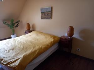 Ένα ή περισσότερα κρεβάτια σε δωμάτιο στο L'Atout de France