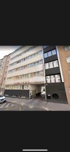 a large building with a parking lot in front of it at bookVienna "Paula" Apartments in Vienna