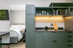 Kuchyň nebo kuchyňský kout v ubytování Village Lofts a 5 minutos da Vila Germânica com piscina aquecida no terraço