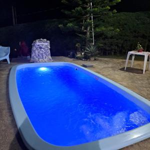 Swimmingpoolen hos eller tæt på Recanto Sonho Meu