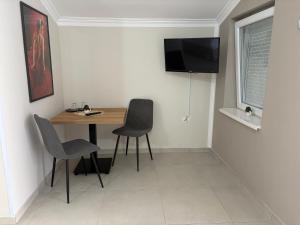 TV a/nebo společenská místnost v ubytování Casa di Pino