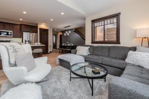 a living room with a couch and a table at Mountainside 15 in Mammoth Lakes