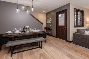 a living room with a table and a couch at Mountainside 15 in Mammoth Lakes +26 photos