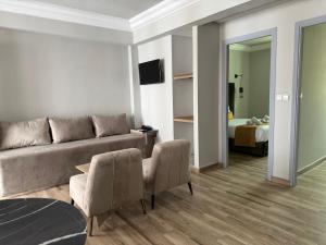 a living room with a couch and a bed at Hamilton Suites & Appart in Casablanca
