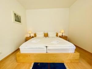 Ένα ή περισσότερα κρεβάτια σε δωμάτιο στο Villa Fortuna Gästehaus App Rügen