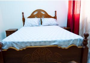 Ένα ή περισσότερα κρεβάτια σε δωμάτιο στο Residencial Mendes