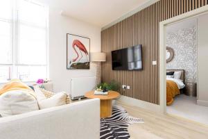 a living room with a zebra patterned wall at Apartment Ten Pelican House in Bournemouth