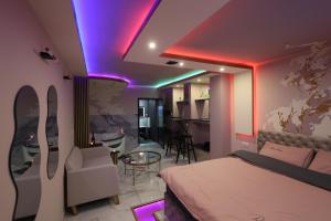 a bedroom with a bed and a table and chairs at Apartman Flamingos in Rača