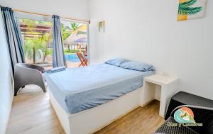 En eller flere senge i et værelse på Villa Los Delfines 2