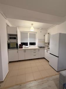 Kuchyň nebo kuchyňský kout v ubytování Cozy 2Rooms + 1 fotografie