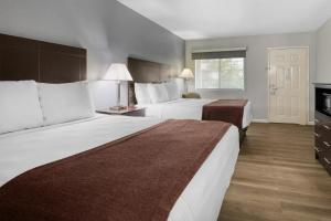 Ένα ή περισσότερα κρεβάτια σε δωμάτιο στο Best Western Lake Conroe Inn +17 φωτογραφίες