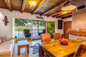 a living room with a table with a bowl of fruit on it at VILLA Ružiná in Divín