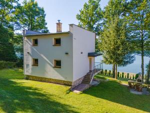 a house with a staircase leading up to it at VILLA Ružiná in Divín