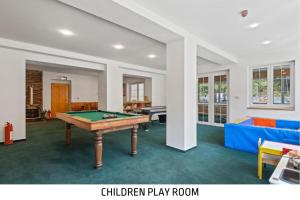 Herní místnost v ubytování Špindl Lodge Apartments Self check-in & Sauna + 20 fotografií