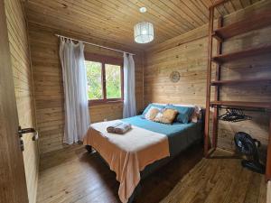 Postel nebo postele na pokoji v ubytování Recanto dos Bambus - Cabana na Praia do Rosa