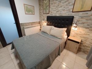 Postel nebo postele na pokoji v ubytování ESTUDIO FAMILIAR En EZCARAY + 27 fotografií