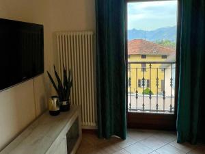 a room with a window with a view of a building at Casa Di Gloria in Perledo