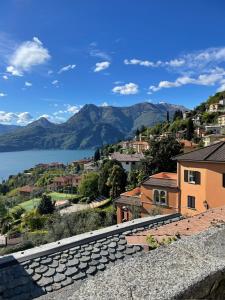 a view of a town with a lake and mountains at Casa Di Gloria in Perledo