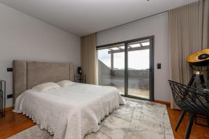 Ένα ή περισσότερα κρεβάτια σε δωμάτιο στο AB Villa Real-Estate +38 φωτογραφίες