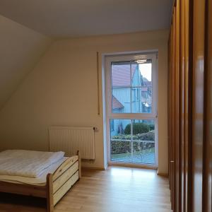 Postel nebo postele na pokoji v ubytování Domus Limes, RuheOase am Schloss