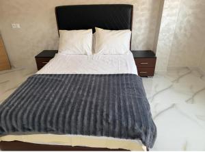 Ένα ή περισσότερα κρεβάτια σε δωμάτιο στο Bahija