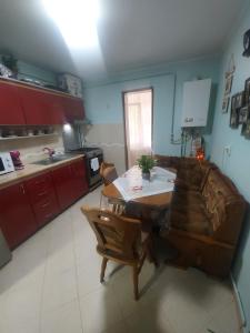 a living room with a couch and a table at Emilia's Dreamhouse in Gura Humorului