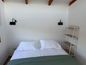 Postel nebo postele na pokoji v ubytování Tiny House El Maiten