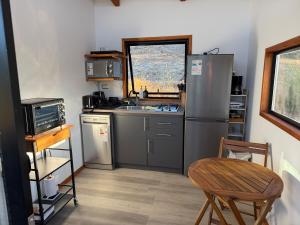 Kuchyň nebo kuchyňský kout v ubytování Tiny House El Maiten + 32 fotografií