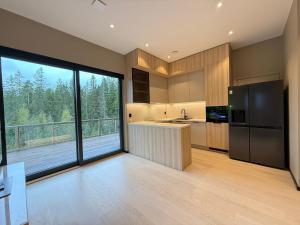 Η κουζίνα ή μικρή κουζίνα στο Modern apartment near Gardermoent airport