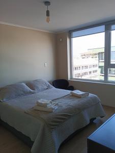 Ένα ή περισσότερα κρεβάτια σε δωμάτιο στο Departamentos Pehumayen