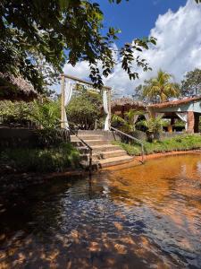 a group of stairs next to a body of water at Chalés da Chapada in Carolina +60 photos