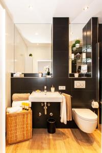 a bathroom with a sink and a toilet at Little Oasis Near Frankfurt in Neulsenburg