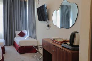 Postel nebo postele na pokoji v ubytování فندق الاصول + 5 fotografií