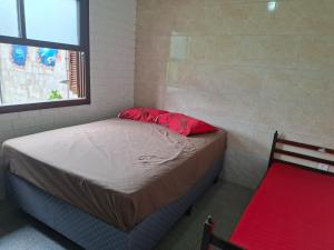 a small bedroom with a bed and a window at Giuseppe & Giuseppin in Torres