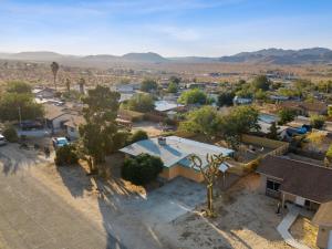 an aerial view of a small town in the desert at The Cosmic Casita in Joshua Tree