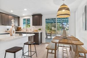 a kitchen with a table and chairs and a large window at The Cosmic Casita in Joshua Tree