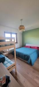 a bedroom with a large bed in a room at Jamari Sangro House in Castel di Sangro