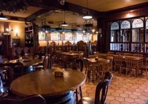 a restaurant with tables and chairs in a room at RESIDENCE OLD STORIES in Barile