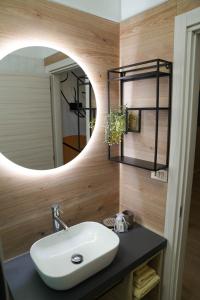a bathroom with a sink and a mirror at Appartamenti Armida in Chioggia